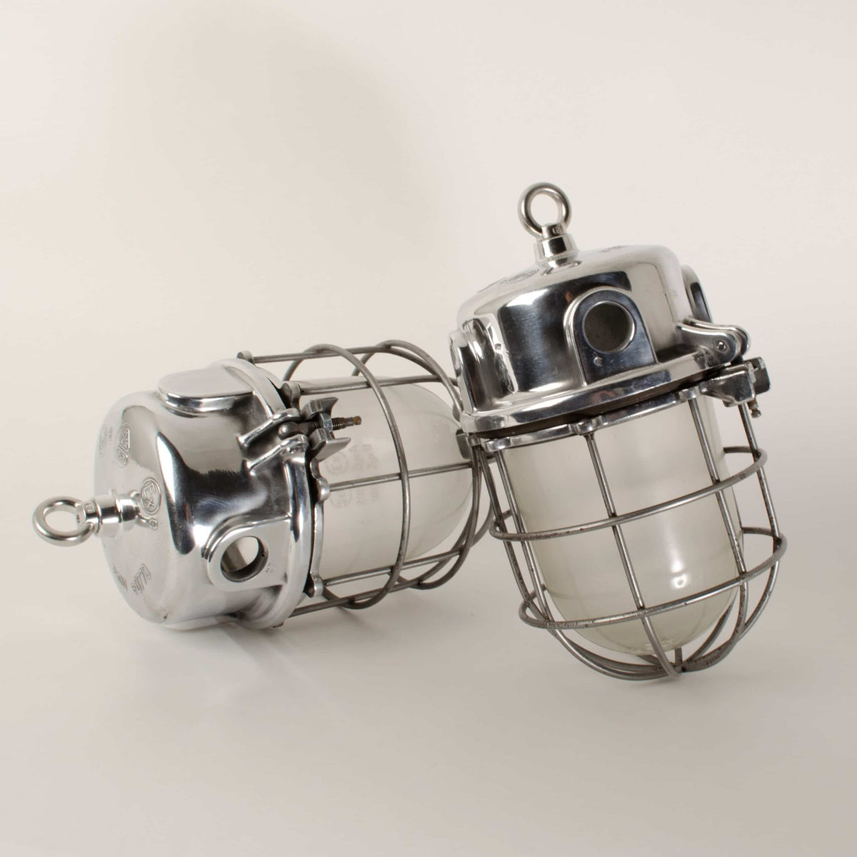Pair of caged aluminium pendants